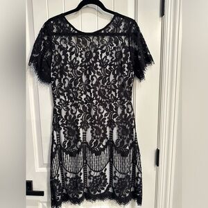 Black lace cocktail dress with white lining